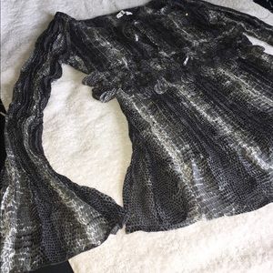 Sheer blouse with embellishment.